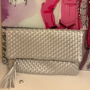 Charming Charlie Metallic Silver Woven Fold-Over Clutch with Tassel Accent